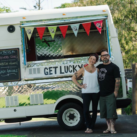 Sarah and Otis in front of their food truck The Lucky Taco.