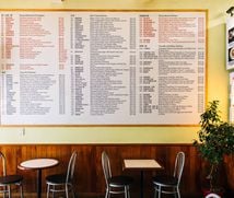 A very large menu on the wal at KC Cafe and Takeaway in Wellington.