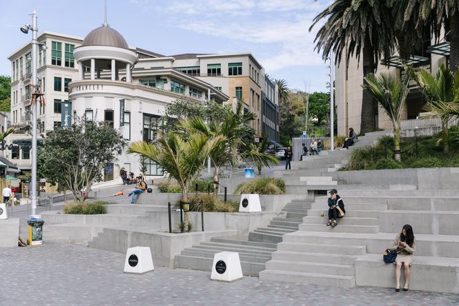 People sitting on steps at Freyberg Place.