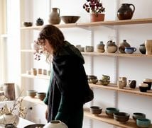 A customer browsing ceramics at Ata.
