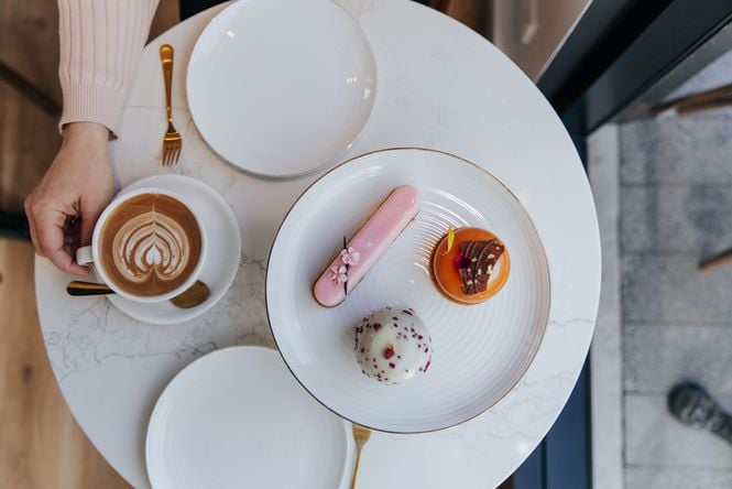 A flatlay of patisseries on a table.
