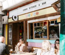 People dining outside Conch in Auckland.